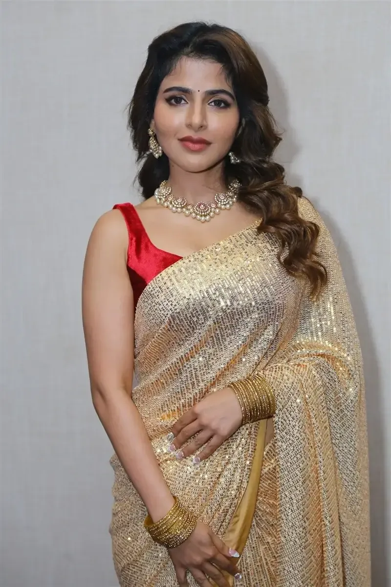 Iswarya Menon in Gold color Saree at Spy Movie Release Event